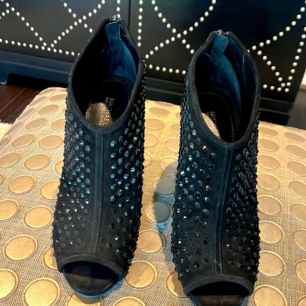 Black studded peep-toe bootie.